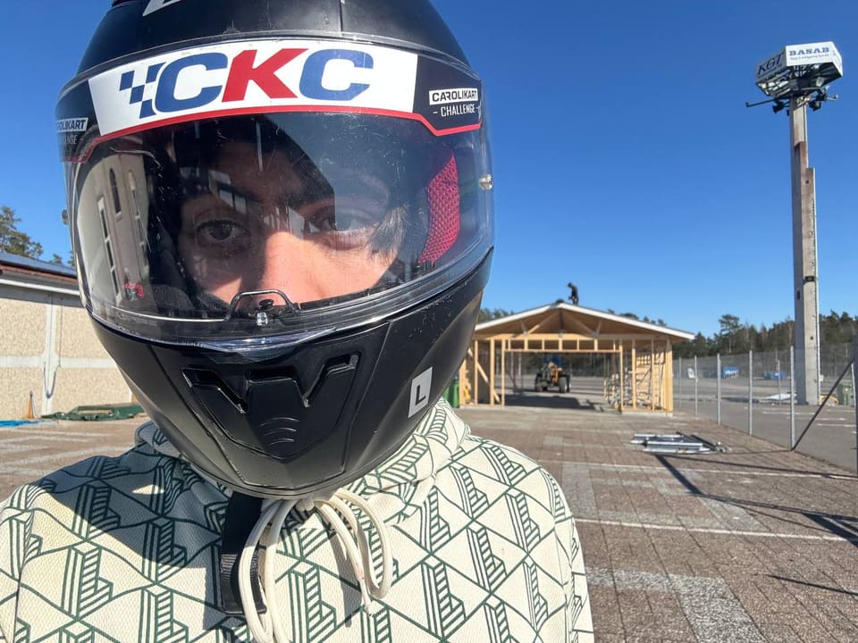 Serhii in a karting helmet at a track